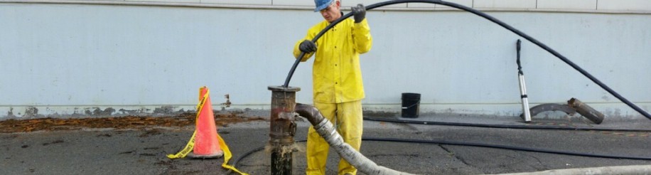 Worker cleaning well