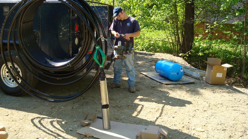 Man working on pump system